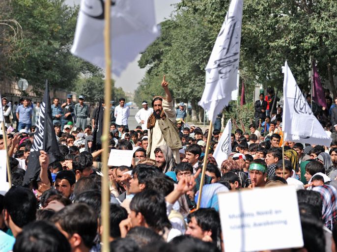 Afghan demonstrators gather for an anti-US protest in Kabul on September 16, 2012. Hundreds of students poured into the streets of Kabul September 16 shouting anti-US slogans to protest against a film mocking Islam that has sparked deadly riots in the Middle East and North Africa, police said. The protesters, mostly students from Kabul University, shouted "death to America" as they blocked a road near their compound. AFP PHOTO/Massoud HOSSAINI