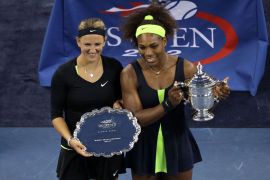 NEW YORK, NY - SEPTEMBER 09: Serena Williams of the United States poses with the championship trophy next to Victoria Azarenka of Belarus following her victory in the women's singles final match on Day Fourteen of the 2012 US Open at USTA Billie Jean King National Tennis Center on September 9, 2012 in the Flushing neighborhood of the Queens borough of New York City. Alex Trautwig/Getty Images/AFP== FOR NEWSPAPERS, INTERNET, TELCOS & TELEVISION USE ONLY ==
