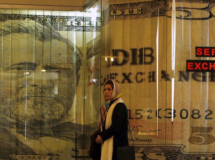 epa00901364 A foreign currency exchange shop with a US dollar curtain in north Tehran on Saturday, 13 January 2007. The Iranian government decided last month to use euro instead of US dollar in the country's budget for the next Iranian year (21 March 2007 - 20 March 2008) and also in foreign as well as oil trade and also assets abroad. EPA/ABEDIN TAHERKENAREH