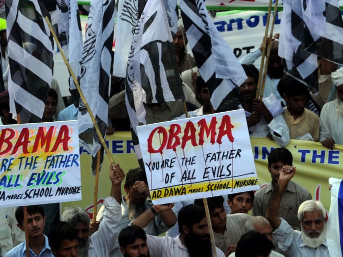 Activists of Jamaat-ud-Dawa (JuD) carry placards at a protest rally in Lahore on September 30, 2012, against the US-made anti-Islam film and the publication of blasphemous cartoons in France. Some 5,000 people rallied in the southern Pakistan port city of Karachi to denounce a US-made anti-Islam film and the publication of blasphemous cartoons in France, police and witnesses said. AFP PHOTO/Arif ALI