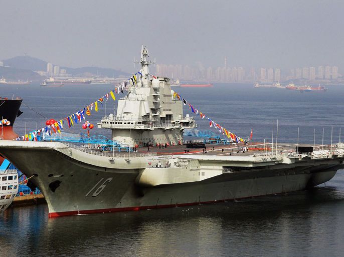 This photo taken on September 24, 2012 shows China's first aircraft carrier, a former Soviet carrier called the Varyag, docked after its handover to the People's Liberation Army (PLA) navy in Dalian, northeast China's Liaoning province. China's first aircraft carrier was handed over on September 23