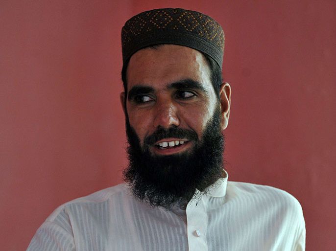 This photograph taken on August 24, 2012 shows Hafiz Khalid Chishti, the Imam of a local mosque, looking on during an interview with AFP in Mehrabad, a suburb of the capital city of Islamabad.  Pakistani police have arrested a Muslim cleric on suspicion of planting evidence against a Christian girl accused of blasphemy, officers said September 2, 2012