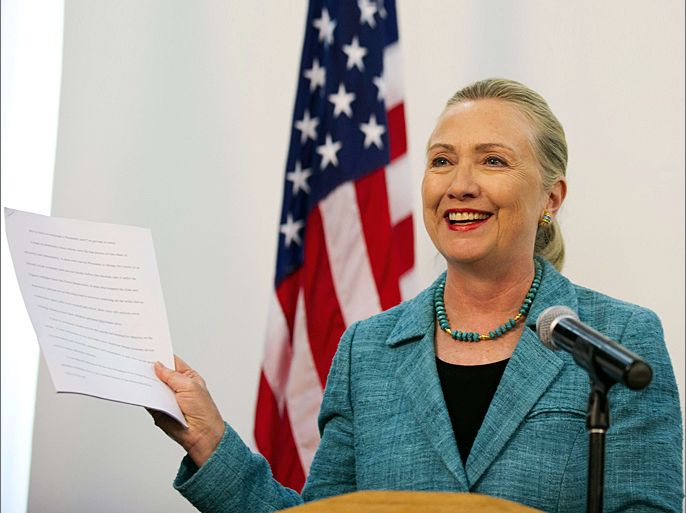 US Secretary of State Hillary Clinton holds up paperwork as she refers to the "As Prepared" version of former US president Bill Clinton's Democratic National Convention speech that she had read, during a joint press conference with East Timor's prime minister at the Government Palace in Dili on September 6, 2012. Clinton is paying her first visit to East Timor in hopes of offering political and economic support to the fledgling democracy, which is one of the poorest nations in the Asia-Pacific region. AFP PHOTO / POOL / Jim WATSON
