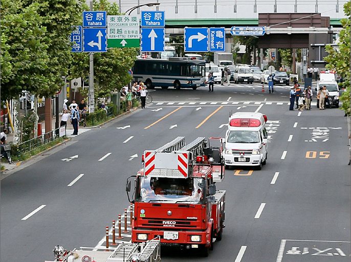 Emergency vehicles move along a police-controlled street during a nation-wide earthquake drill in Tokyo on September 1, 2012. Japan conducted a national earthquake drill on September 1 after the government unveiled a worst case disaster scenario that warned a monster jolt in the Pacific Ocean could kill over 320,000 people. AFP PHOTO / JIJI PRESS JAPAN OUT