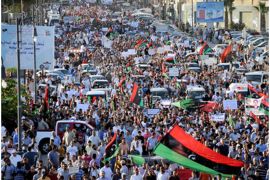 A photograph made available on 22 September 2012, shows Libyan protesters demonstrating during an anti-militia march in Benghazi, Libya, 21 September 2012. Media reports state that demonstrators stormed the headquarters of an Islamist militia in the eastern Libyan city of Benghazi late on 21 September 2012 and evicted its members. The move against the premises of Ansar al-Sharia appeared to be part of coordinated raids by security forces and protestors on several militia offices, after a day of public demonstrations against armed groups. EPA/MOHAMMED ELRYANI