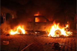 A vehicle and the surrounding area are engulfed in flames after it was set on fire inside the US consulate compound in Benghazi late on September 11, 2012. An armed mob protesting over a film they said offended Islam, attacked the US consulate in Benghazi and set fire to the building, killing one American, witnesses and officials said. AFP PHOTO