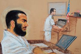 epa01575992 A drawing by artist Janet Hamlin, reviewed by the US military, shows Canadian-born accused terrorist Omar Khadr (L) doodling as his lead defense counsel, Navy Lieutenant Commander William Kuebler, addresses the judge, Army Colonel Pat Parrish, during a pre-trial session December 12, 2008 at "Camp Justice" on US Naval Station Guantanamo Bay. Khadr faces charges of murdering a US soldier in a 2002 firefight in Afghanistan. EPA/MANDEL NGAN / POOL