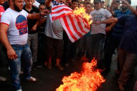 Protesters burn a U.S. flag during a protest against a film they consider blasphemous to Islam and insulting to the Prophet Mohammad in Tripoli, northern Lebanon September 13, 2012. REUTERS