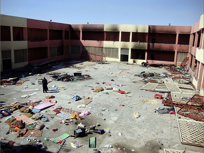 (FILES) - A File picture taken on March 14, 2011 shows Mattresses and other items are strewn in the court yard of a prison in the northern Iraqi city of Tikrit, following riots in which the prison was set alight killing one prisoner and wounding seven others and wounding five prison guards. Dozens of prisoners were on the loose on September 28, 2012 after militants attacked the Tikrit prison, leaving at least 13 policemen dead. The violence at the prison came after Al-Qaeda's Iraqi front group announced a campaign to regain territory and said it aimed to help its jailed members escape. AFP PHOTO/MAHMUD SALEH