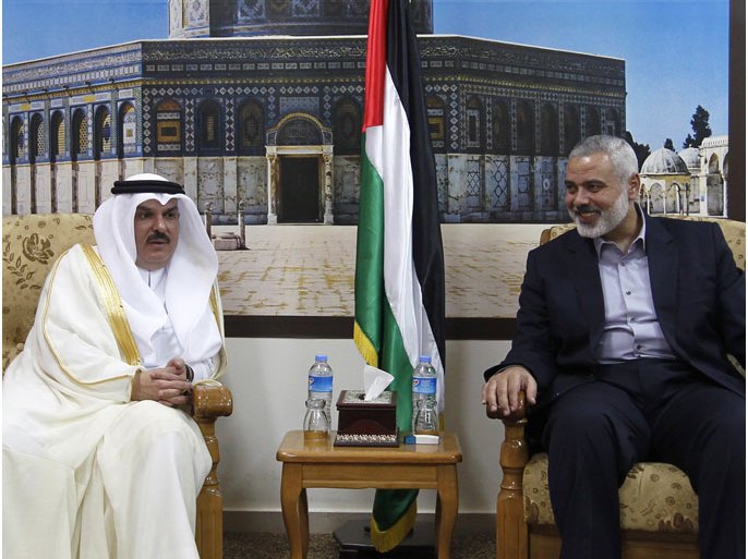 Head of the Hamas government in the Gaza Strip, Ismail Haniya (R), meets with the head of a Qatari delegation Mohammed al-Emadi in Gaza City on September 25, 2012, where a number of projects included in the Qatari grant for the reconstruction of Gaza are expected to be launched