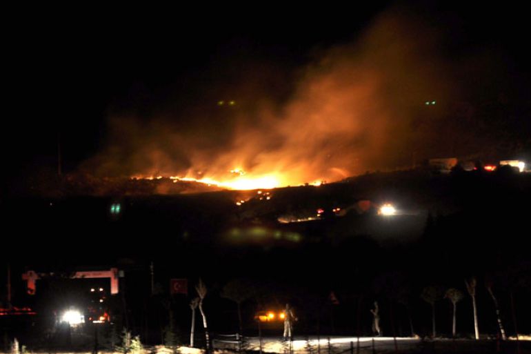 Flames are seen after a huge blast rocked central Turkish province of Afyonkarahisar, on September 6, 2012. A military storage filled with hand grenades exploded, leaving 25 soldiers dead and four others injured. The blast occurred between Atakoy neighborhood and Kanlica village of Afyonkarahisar, close to residential areas but in an isolated territory. Initial reports claimed that the blast occured after a mistake while officers were classifying the hand grenades.