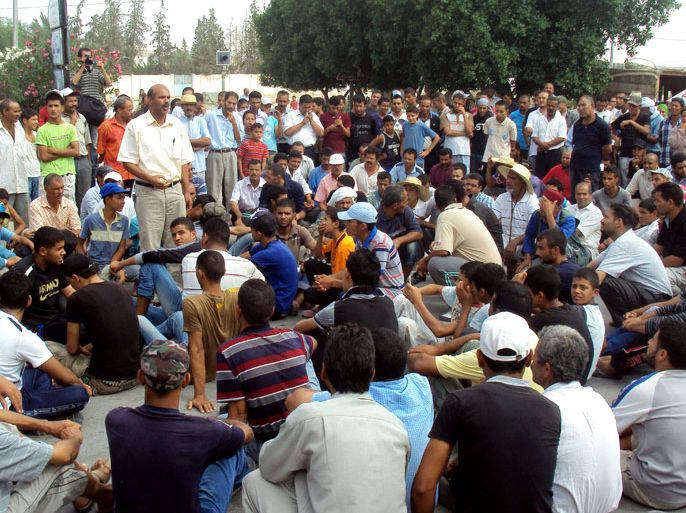 Tunisian protesters take part in a sit-in during a general strike in Menzel Bouzaiane in the Sidi Bouzid region on September 29, 2012. Menzel Bouzaiane residents called for the strike to protest against police violence towards demonstrators and demand the release of dozens of people, including a local union leader, arrested during a sit-in in a village in the region