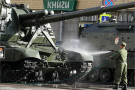Caption:A Russian soldier cleans self-propelled howitzers standing on Tverskaya street during the general rehearsal of the military parade in Moscow, Russia, 06 May 2012. The parade will take place on the Red Square on 09 May, devoted to the victory of the Soviet Union over Nazi Germany in the WWII and will include the demonstration of heavy military technics and aviation. EPA/SERGEI ILNITSKY