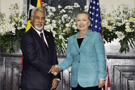 East Timor Prime Minister Xanana Gusmao (L) shakes hands with US Secretary of State Hillary Clinton (R) during her visit to Dili on September 6, 2012. Clinton sought to encourage self-sufficiency in East Timor on a first visit to one of the poorest nations in Asia where China is playing a growing role. AFP PHOTO / VALENTINO DE SOUSA