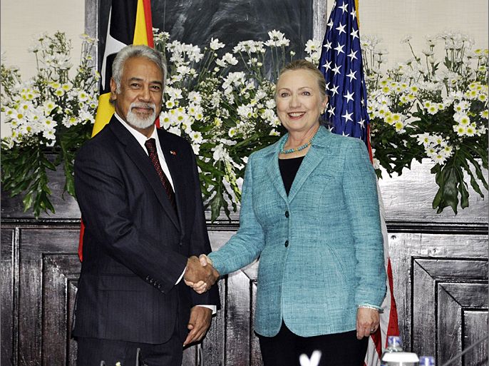 East Timor Prime Minister Xanana Gusmao (L) shakes hands with US Secretary of State Hillary Clinton (R) during her visit to Dili on September 6, 2012. Clinton sought to encourage self-sufficiency in East Timor on a first visit to one of the poorest nations in Asia where China is playing a growing role. AFP PHOTO / VALENTINO DE SOUSA