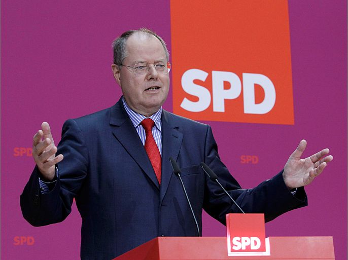 Former German finance minister Peer Steinbrueck and Social Democrat (SPD) member gives a speech at the party headquarters in Berlin September 28, 2012. News on Friday that Peer Steinbrueck, a former finance minister with an acerbic wit, will lead the opposition Social Democrats (SPD) into the 2013 vote will have stirred unease in Chancellor Angela Merkel's entourage, observers say. REUTERS/Tobias Schwarz (GERMANY - Tags: POLITICS)