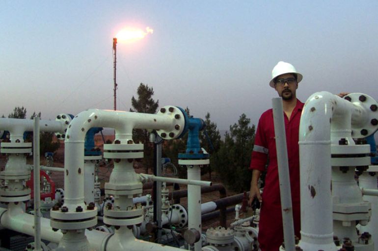 Iraqi worker opening an oil valve at Taq Taq oil field in Erbil, 310 km (190 miles) north of Baghdad, Iraq, on 30 May 2009. The Ministry of Natural Resources in the regional government announced the official start 2009 of oil exports from the Tawke field for 01 June at an average rate of 60,000 bpd, The ministry also said that 40,000 bpd of crude exports from Taq Taq field, which has estimated oil reserves of 1.2 billion barrels, would begin traveling by truck and through an Iraqi-Turkish export pipeline and the exported crude from both fields will be marketed by Iraq's State Oil Marketing Organization (SOMO), noting that the revenue will be deposited to the federal government’s account. EPA/KAMAL AKRAYI