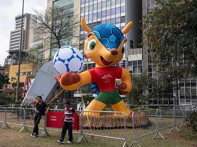 An inflatable mascot of the FIFA World Cup Brazil 2014, a "Tatu-bola" (armadillo in Portuguese), is displayed at Vale do Anhangabau square in Sao Paulo, Brazil, on September 24, 2012. The FIFA is running a contest on the internet to choose the name of the mascot between "Zuzeco", "Amijubi" or "Fuleco". AFP