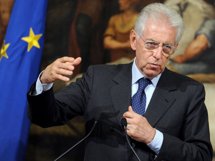 epa03386647 Italian Prime Minister Mario Monti gestures during a press conference with President of European Commission Jose' Manuel Durao Barroso (not pictured) at Chigi palace in Rome, Italy, 06 September 2012. EPA/ETTORE FERRARI