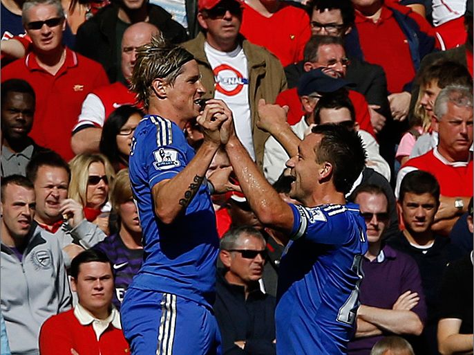 Chelsea's Fernando Torres (L) celebrates his goal against Arsenal with teammate John Terry during their English Premier League soccer match at the Emirates Stadium in London September 29, 2012. REUTERS/Eddie Keogh (BRITAIN - Tags: SPORT SOCCER) FOR EDITORIAL USE ONLY. NOT FOR SALE FOR MARKETING OR ADVERTISING CAMPAIGNS. NO USE WITH UNAUTHORIZED AUDIO, VIDEO, DATA, FIXTURE LISTS, CLUB/LEAGUE LOGOS OR "LIVE" SERVICES. ONLINE IN-MATCH USE LIMITED TO 45 IMAGES, NO VIDEO EMULATION. NO USE IN BETTING, GAMES OR SINGLE CLUB/LEAGUE/PLAYER PUBLICATIONS
