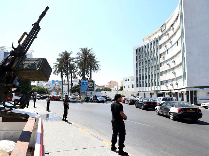 Security men guard the entrance to the Interior Ministry in the Libyan capital, Tripoli, on August 30, 2012,