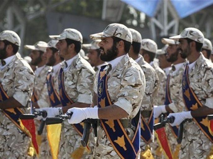 In this Sept. 22, 2011 photo, members of Iran's Revolutionary Guard march in front of the mausoleum of the late Iranian revolutionary founder Ayatollah Khomeini, just outside Tehran, Iran, during armed an forces parade marking the 31st anniversary of the start of the Iraq-Iran war. Among the many mysteries inside Iran's ruling hierarchy, the Quds Force, which sits atop the vast military and industrial network of the Revolutionary Guard, has a special place in the shadows