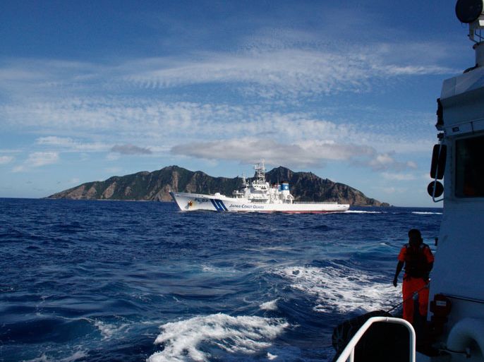 epa03362341 A photograph made available on 15 August 2012 and dated 07 April 2012 showing Japanese and Taiwan coastguard ships in a standoff near Diaoyu Islands. Media reports on 15 August 2012 state that seven activists seeking to declare China's claim to a group of Japanese-controlled islands swam to one of the Diaoyu Islands from a fishing vessel on 15 August the Japan Coast Guard statee. The other two swam back to the vessel before being questioned by Japanese authorities. EPA/DAVID CHANG