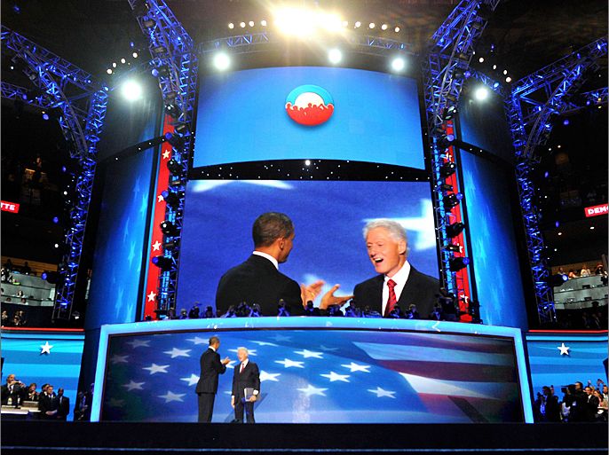 The 42nd President of the United States Bill Clinton and the 44th President of the United States Barack Obama acknowledge the audience at the Time Warner Cable Arena in Charlotte, North Carolina, on September 5, 2012 on the second day of the Democratic National Convention (DNC). The DNC is expected to nominate US President Barack Obama to run for a second term as president on September 6th.AFP PHOTO / Mladen ANTONOV