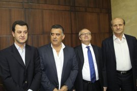 Beirut, -, LEBANON : Turkish national Aydin Tufan Tekin (L), who has been abducted by gunmen of Lebanon's Muqdad clan poses with Lebanese Minister of Interior Marwan Charbel (R) and the Chief of Lebanese General Security Chief Brigadier Abbas Ibrahim (2ndL) after being handed to the Turkish Ambassador to Lebanon Anan Qzetlitz (2ndR) at the Lebanese General Security headquarters in Beirut on September 11, 2012. Lebanese security forces freed four Syrian hostages today in a raid on the powerful Shi'ite Muslim clan, which kidnapped more than 20 people last month among them the Turkish businessman. The clan said its abductions were in response to the capture of one of its kinsmen by Syrian rebels trying to topple Assad. The clan later released all but the four Syrians and the Turkish national. AFP PHOTO/ ANWAR AMRO