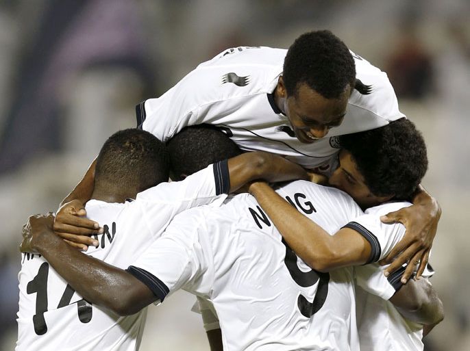 Al-Sadd players celebrate after scoring a goal against El-Jaish during their Qatar Stars League soccer match in Doha October 27, 2012. REUTERS/Fadi Al-Assaad (QATAR - Tags: SPORT SOCCER)