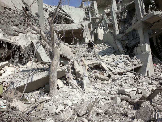 ‪الدمار في عربين بريف دمشق‬ (الفرنسية)