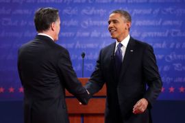 Democratic presidential candidate, U.S. President Barack Obama (R) shakes hands with Republican presidential candidate, former Massachusetts Gov. Mitt Romney (L) during the Presidential Debate at the University of Denver on October 3, 2012 in Denver, Colorado. The first of four debates for the 2012 Election, three Presidential and one Vice Presidential, is moderated by PBS's Jim Lehrer and focuses on domestic issues: the economy, health care, and the role of government. Chip Somodevilla/Getty Images/AFP== FOR NEWSPAPERS, INTERNET, TELCOS & TELEVISION USE ONLY ==