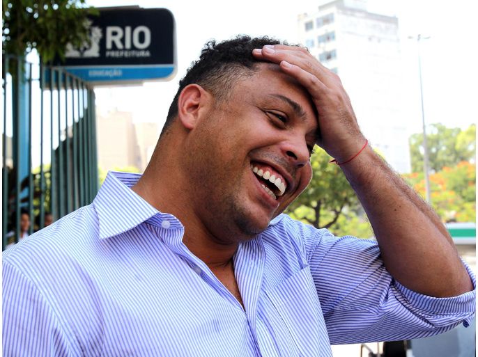 Former Brazilian soccer player Ronaldo laughs during the launch of a campaign in order to increase workplace safety at Maracana stadium in Rio de Janeiro Brazil 02 March 2012. The Maracana stadium is currently under reconstruction for the 2014 FIFA Soccer World Cup and the 2016 Olympic Summer Games