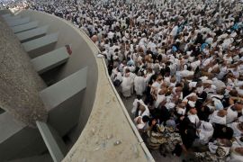 Muslim pilgrims throw pebbles at pillars during the "Jamarat" ritual, the stoning of Satan, in Mina near the holy city of Mecca, on October 26, 2012. Pilgrims pelt pillars symbolising the devil with pebbles to show their defiance on the third day of the hajj as Muslims worldwide mark the Eid al-Adha or the Feast of the Sacrifice, marking the end of the hajj pilgrimage to Mecca and commemorating Abraham's willingness to sacrifice his son Ismail on God's command in the holy city of Mecca. AFP PHOTO/FAYEZ NURELDINE