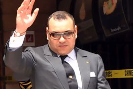 f_A picture taken on April 30, 2011 shows Morocco's King Mohammed VI waving as he visits the Argana cafe where a bomb killed 16 people on April 28 in Marrakesh. Some of Moroccan King Mohammed VI's political and religious powers