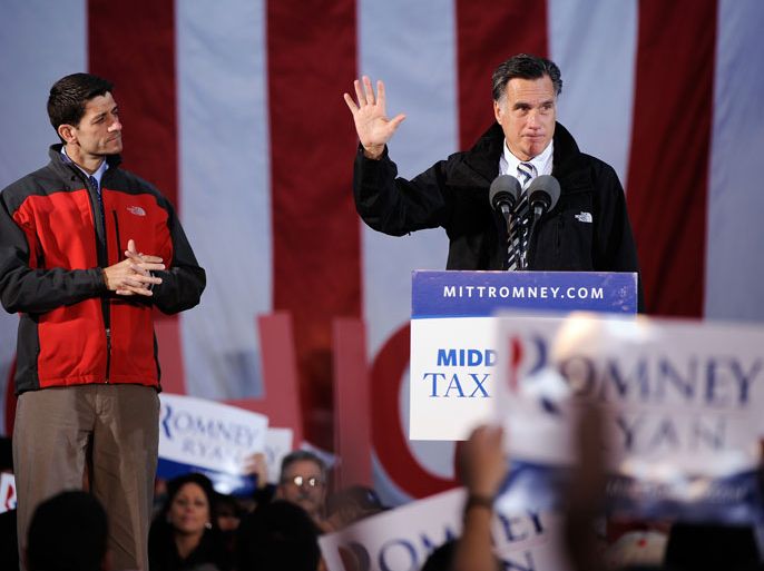 LANCASTER, OH - OCTOBER 12: Republican presidential candidate, former Massachusetts Gov. Mitt Romney (R) and Republican vice presidential candidate, U.S. Rep. Paul Ryan (R-WI) speak on stage at a rally on October 12, 2012 in Lancaster, Ohio. The two were campaigning a day after Ryan's debate with U.S. Vice President Joe Biden. Jamie Sabau/Getty Images/AFP== FOR NEWSPAPERS, INTERNET, TELCOS & TELEVISION USE ONLY