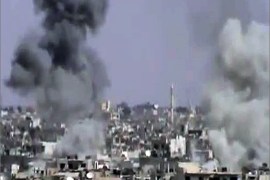 An image grab taken from a video uploaded on YouTube on October 5, 2012 allegedly shows smoke billowing following shelling by Syrian government forces in the central city of Homs . Warplanes pounded rebel-held areas of Homs in the Syrian city's heaviest onslaught for months , monitors said, as Turkey reportedly returned cross-border shellfire for the second time this week. AFP PHOTO/YOUTUBE == RESTRICTED TO EDITORIAL USE - MANDATORY CREDIT "AFP PHOTO/YOUTUBE" - NO MARKETING NO ADVERTISING CAMPAIGNS - DISTRIBUTED AS A SERVICE TO CLIENTS - AFP IS USING PICTURES FROM ALTERNATIVE SOURCES AS IT WAS NOT AUTHORISED TO COVER THIS EVENT, THEREFORE IT IS NOT RESPONSIBLE FOR ANY DIGITAL ALTERATIONS TO THE PICTURE'S EDITORIAL CONTENT, DATE AND LOCATION WHICH CANNOT BE INDEPENDENTLY VERIFIED ==
