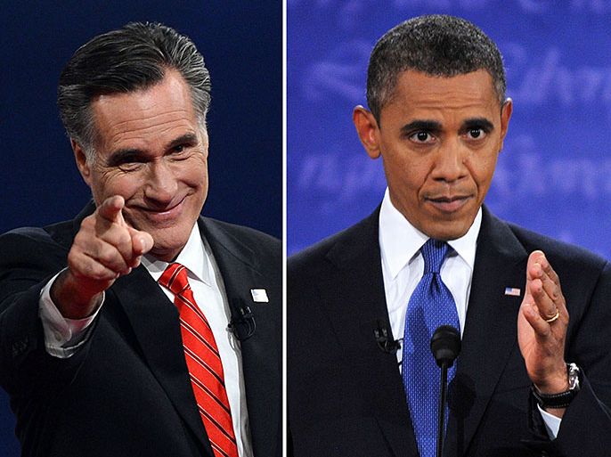 US President Barack Obama (R) speaks during his debate with Republican Presidential candidate Mitt Romney (L), who greets the audience at the conclusion in Denver, Colorado, on October 3, 2012. AFP PHOTO / Nicholas KAMM (R)/SAUL LOEB (L)
