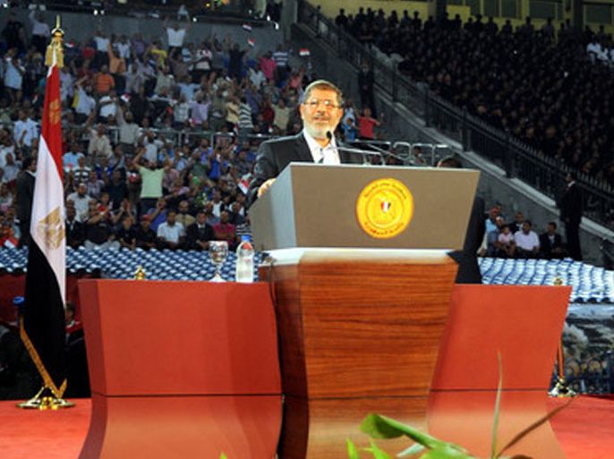 A handout photo made available by the Egyptian presidency shows Egyptian President Mohamed Morsi speaking during a ceremony to commemorate the 39th anniversary of the Arab-Israeli war, at Cairo Stadium, Cairo, Egypt, 06 October 2012. Egypt commemorates the anniversary of the 1973 Arab-Israeli war, known as the October war, when Egypt and Syria took advantage of the Jewish Yom Kippur holiday to launch surprise attacks on territory occupied by Israel in previous conflicts. EPA/EGYPTIAN PRESIDENCY / HO HANDOUT EDITORIAL USE ONLY/NO SALES