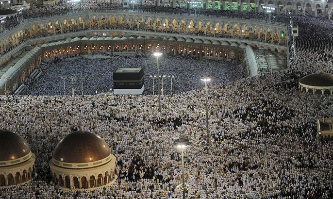 Muslim pilgrims perform their evening prayers, in Grand Mosque in the holy city of Mecca, on October 22, 2012. Over two million Muslims from around the world flood Saudi city of Mecca to perform the annual Hajj pilgrimage, which is one of the five pillars of Islam.