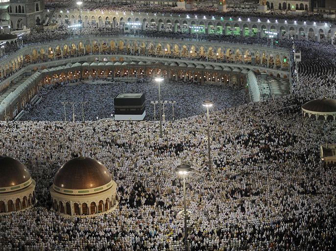 Muslim pilgrims perform their evening prayers, in Grand Mosque in the holy city of Mecca, on October 22, 2012. Over two million Muslims from around the world flood Saudi city of Mecca to perform the annual Hajj pilgrimage, which is one of the five pillars of Islam.