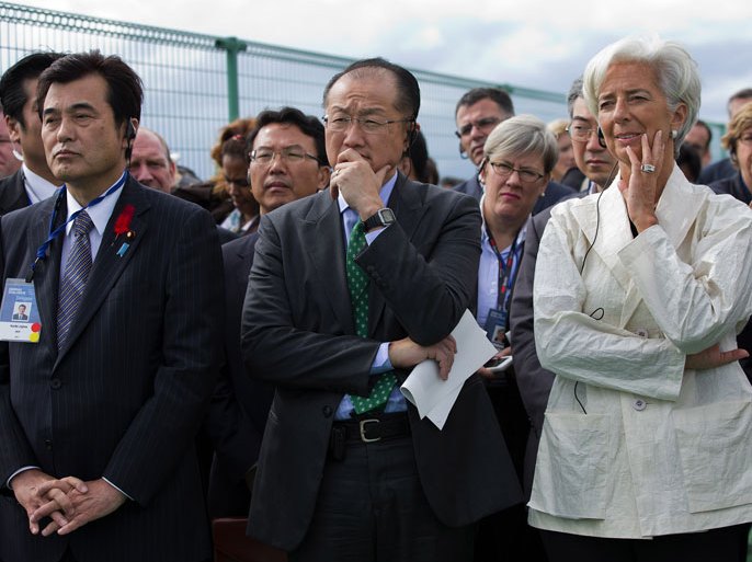epa03427308 A handout photo released by the IMF on 10 October 2012 shows International Monetary Fund's (IMF) Managing Director Christine Lagarde (R), World Bank President Jim Yong Kim (C) and the Japanese Finance Minister Koriki Jojima (L) touring the earthquake damaged city of Sendai, Japan, during a visit on 10 October 2012. Lagarde is in Japan to attend the Annual IMF/World Bank meetings which are being held this year in Tokyo through the week. IMF Staff Photograph/Stephen Jaffe EPA/IMF / Stephen Jaffe HANDOUT EDITORIAL USE ONLY/NO SALES