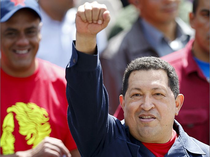 Venezuelan president Hugo Chavez waves to supporters after casting his vote during the presidential election in Caracas October 7, 2012. Venezuelans voted on Sunday with President Hugo Chavez facing the biggest electoral challenge yet to his socialist rule from a young rival tapping into discontent over crime and cronyism. REUTERS/Jorge Silva (VENEZUELA - Tags: POLITICS ELECTION)