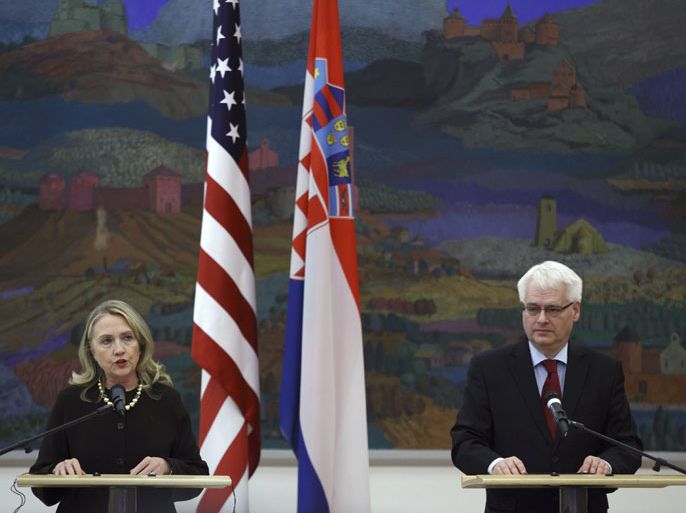 .S. Secretary of State Hillary Clinton speaks during a news conference with Croatian President Ivo Josipovic (R) in Zagreb October 31, 2012. Clinton began a three-nation Balkan trip in Bosnia, where a power struggle between ethnic Serb, Muslim and Croat parties has stymied progress since their 1992-95 war. Clinton's Balkans trip, probably her last before stepping down early next year, represents her final effort to settle some of the legacies of the bloody break-up of federal Yugoslavia in the 1990s, when her husband Bill Clinton was president. REUTERS/Antonio Bronic