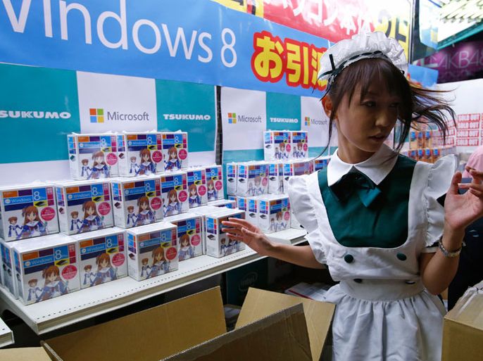 next to Microsoft Corp's Windows 8 operating system, packaged in boxes with anime design, as Windows 8 goes on sale after midnight outside an electronics store at the Akihabara district in Tokyo October 26, 2012. REUTERS/Toru Hanai (JAPAN - Tags: BUSINESS SCIENCE TECHNOLOGY ENTERTAINMENT SOCIETY)