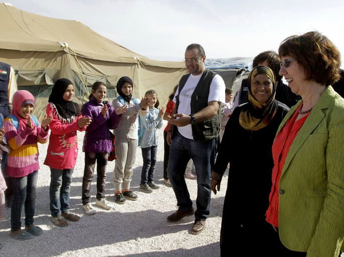 ZAATARI REFUGEE CAMP, -, JORDAN : European Union foreign policy chief Catherine Ashton (R) visits the Al Zaatari Refugee Camp, home to some 36,000 Syrians, in the Jordanian city of Mafraq, near the border with Syria on October 22, 2012, during her five-day Middle East tour. Ashton said in a statement that the trip aimed to take forward the existing cooperation between the EU and its partners in the region. AFP PHOTO/STR