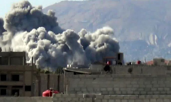 An image grab taken from a video uploaded on YouTube on October 29, 2012, allegedly shows smoke billowing from buildings following shelling by forces loyal to Syrian President Bashar al-Assad on east Ghouta, near the capital Damascus. Clashes erupted between Syrian rebels and troops backed by Palestinian fighters near Damascus on Octboer 30, as the UN-Arab League peace envoy was due in China in a bid to revive struggling efforts to halt the violence. AFP PHOTO/YOUTUBE ==