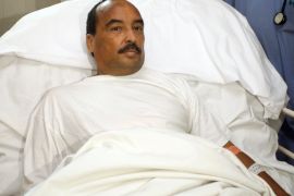 In this Sunday, Oct. 14, 2012, handout photo released by the Mauritanian government news agency AMI (Agence Mauritanienne de l'Information), Mauritanian President Mohamed Ould Abdel Aziz recovers at the Ksar Military Hospital in Noukchott, Mauritania before being evacuated to France for further treatment for a gunshot wound sustained to the arm. Mauritania's Minister of Communication says President Mohamed Ould Abdel Aziz has been lightly wounded by friendly fire after his vehicle was fired upon by the military on the outskirts of the capital, Nouakchott.