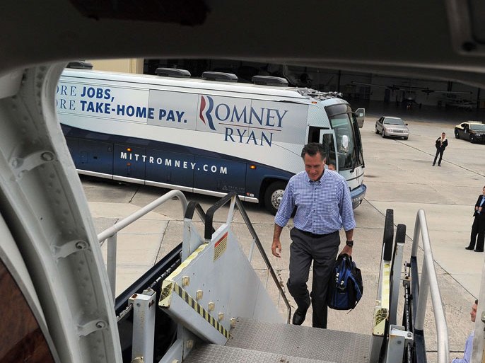 Palm Beach, Florida, UNITED STATES : US Republican presidential candidate Mitt Romney boards his campaign plane on October 7, 2012 in Palm Beach, Florida. AFP PHOTO/Jewel Samad
