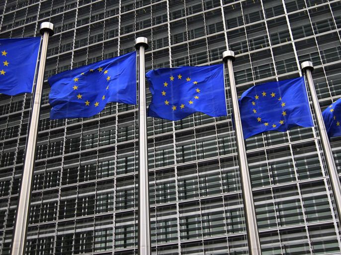 Title:European Union flags fly in front of the European Commission headquarters in Brussels